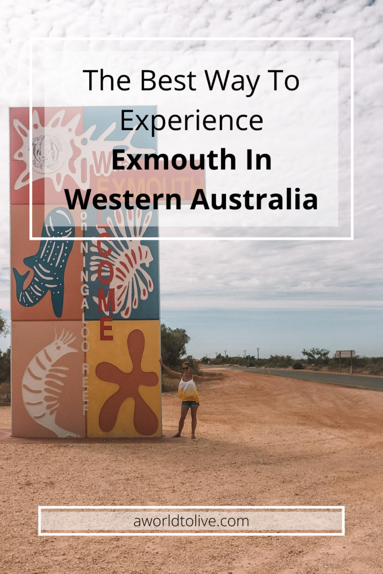 A large colorful sign on the side of the road, advising the beginning of Exmouth. Elyse is standing next to the sign with her arms out. Text over images saying the best way to experience exmouth in western Australia.