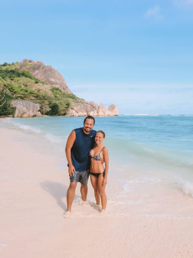 man and women on beach in the Seychelles