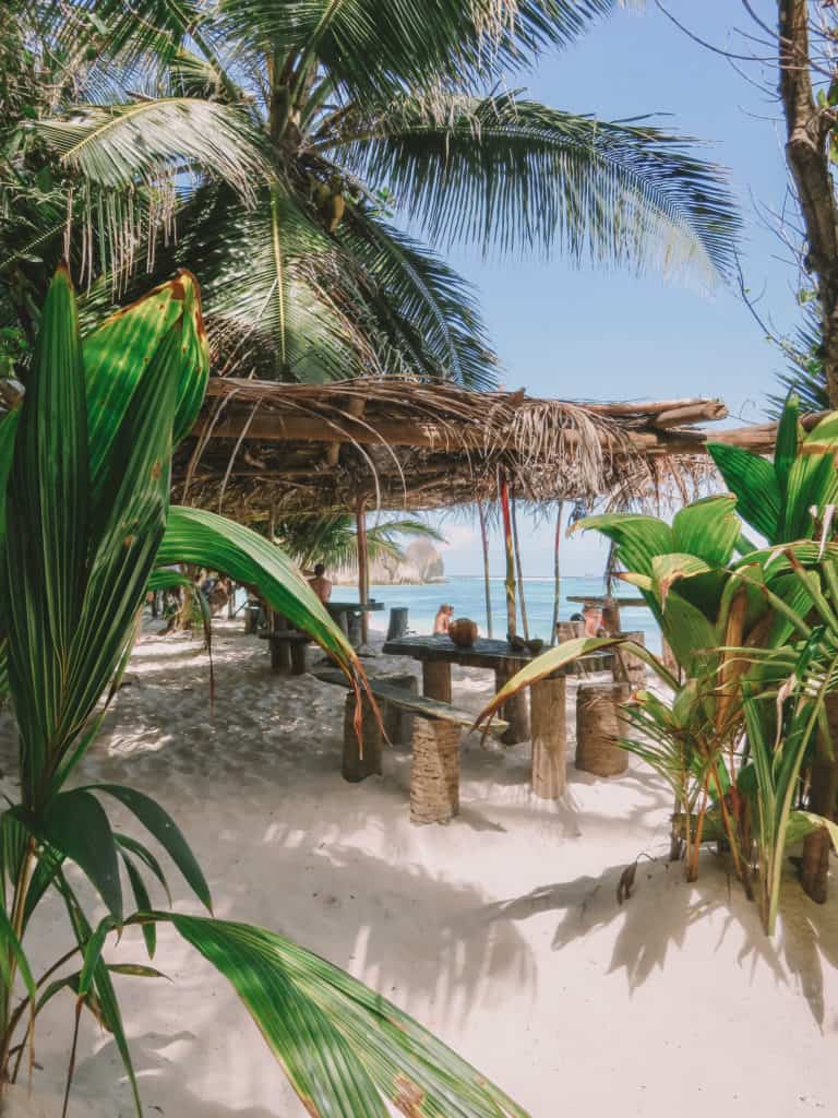 beach restaurant under palm tree in the Seychelles