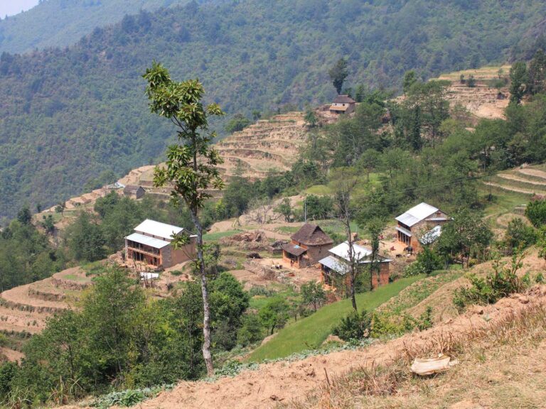 Discovering Nepal. A rural village in Nepal surrounded by farmland