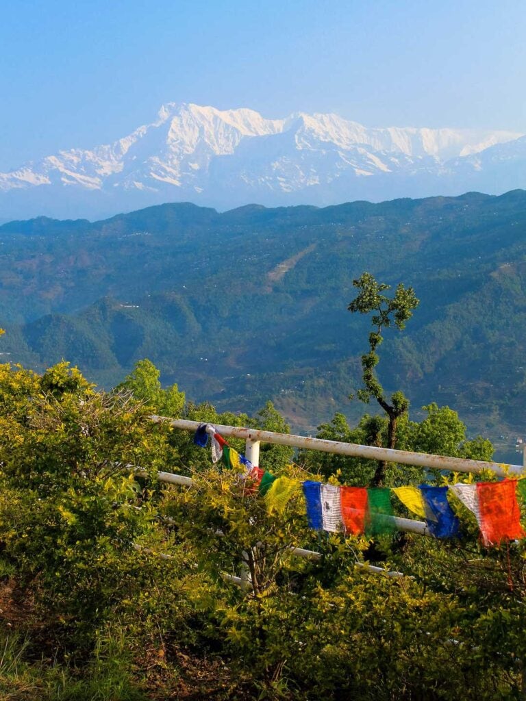 Mountain views and prey flags along a fence. safe viewing in nepal