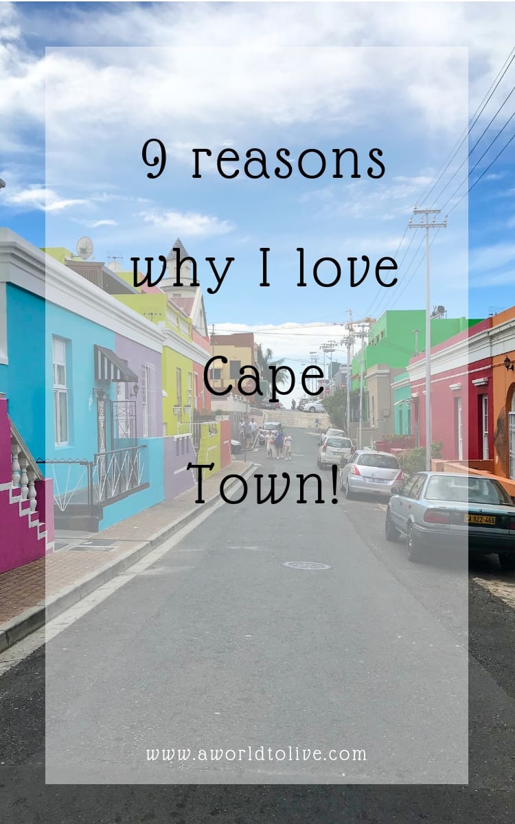 A street with bright colorful houses on either side. Text over the photo saying 9 reasons why I love Cape Town