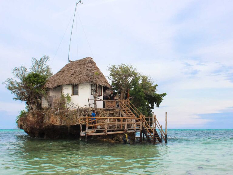 The Rock Restaurant in Zanzibar, is completely surrounded by water. Wooden stair case to the entrance