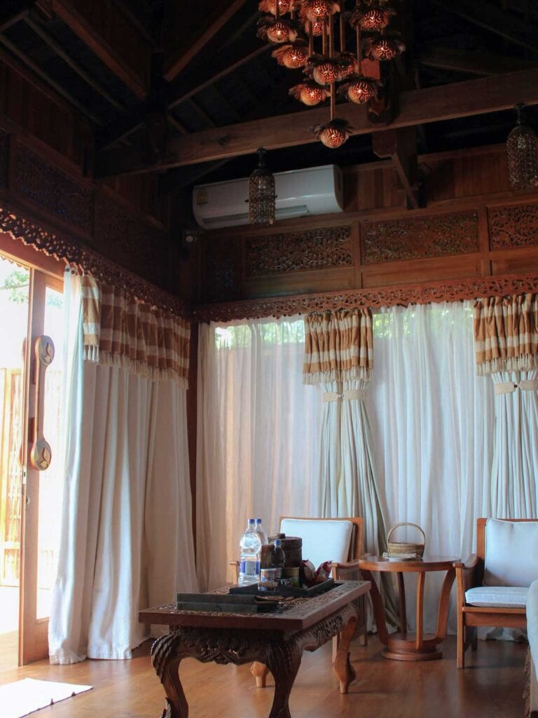 Inside our resorts villa, wooden table with decorative light hanging above