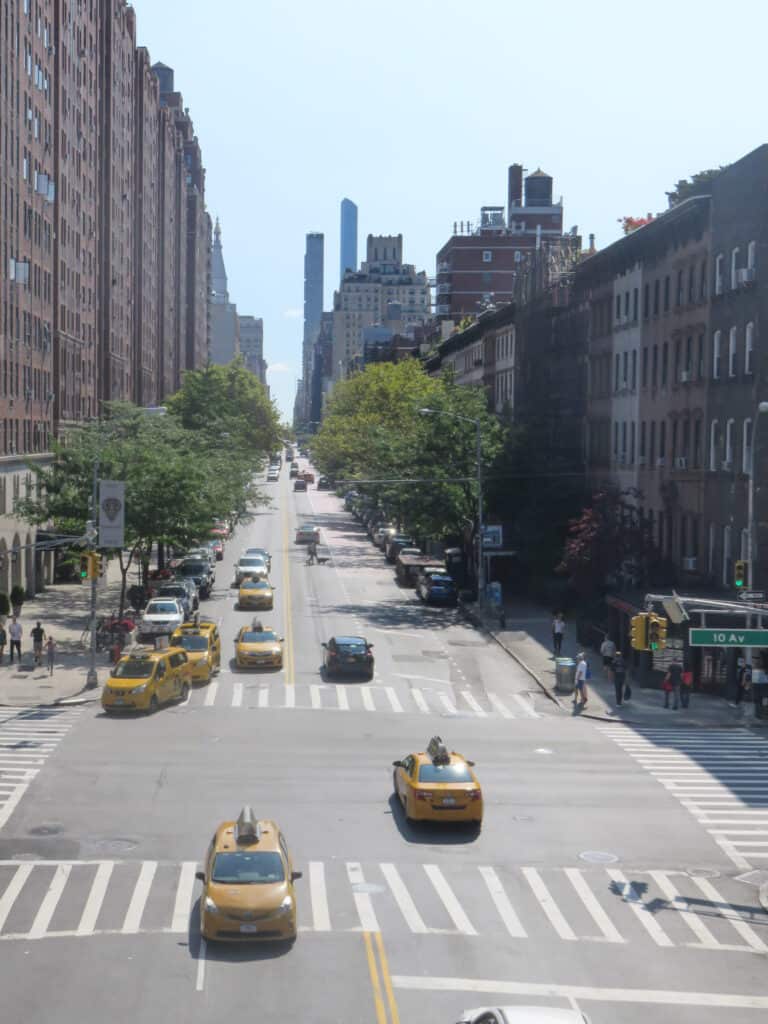 Taken from the New York City High line, one of the free experiences in the city. A photo looking down a street busy with yellow taxis