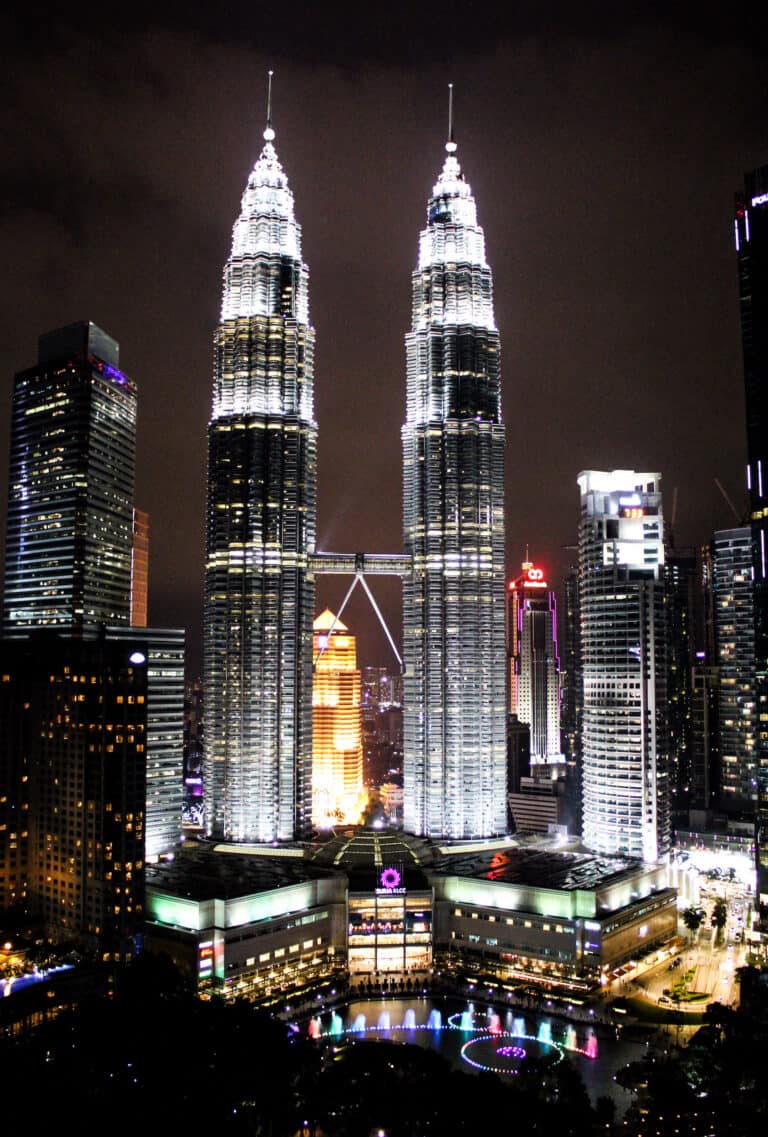 Petronas twin Towers at night and are completely lit up with bright white lights