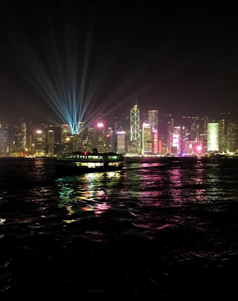 Taken at night while traveling in the Hong Kong ferry. The skyline across the water is brightly lit up