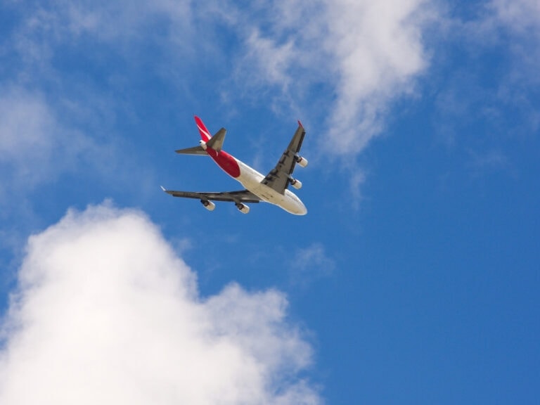 Looking up into the sky and seeing a Qantas Boeing 737 fly over