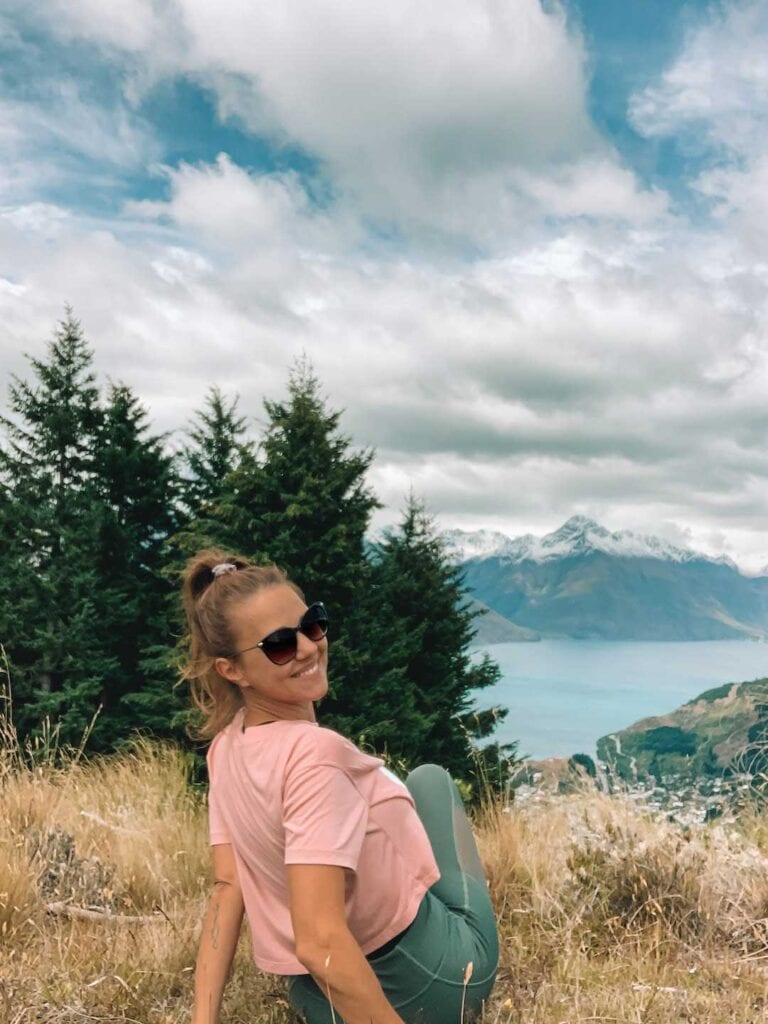 Elyse at the end of her hike up Bobs peak in New Zealand. Part of 5 days in Queenstown