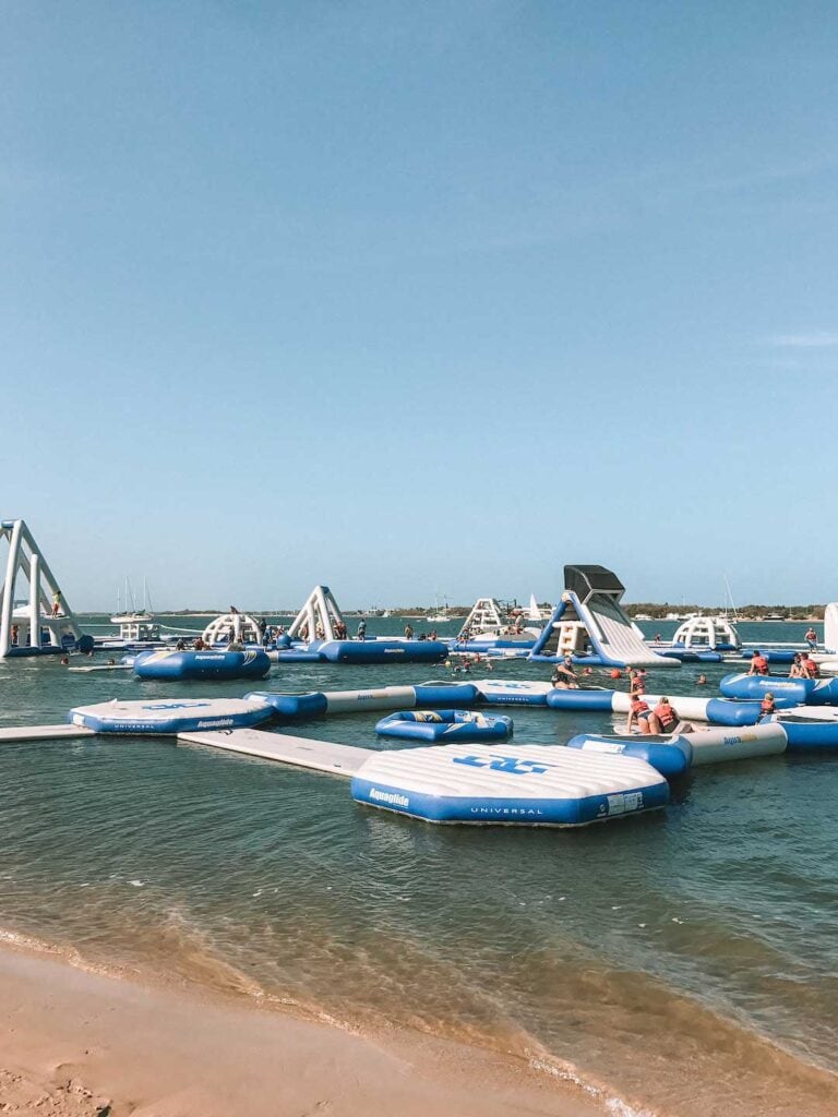 GC Aqua Park is in Southport on the Gold Coast, it's a blue and white inflatable obstacle course on the water