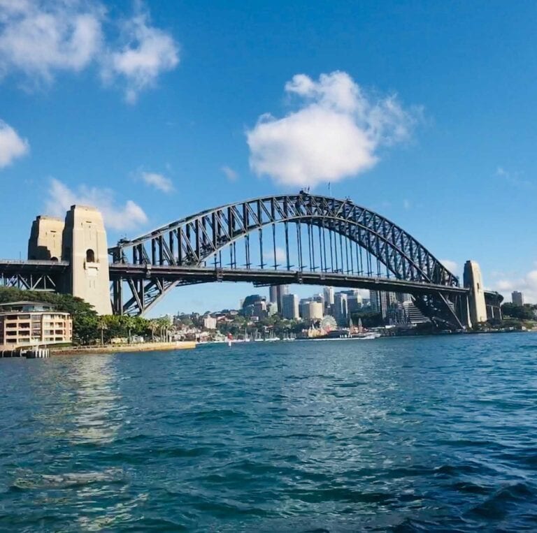 The Sydney harbour bridge, the photo is taken from the water on a sunny day