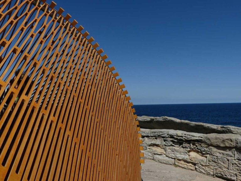 Sydney's Sculpture Walk, a large sculpture is on the rocks in Sydney Australia
