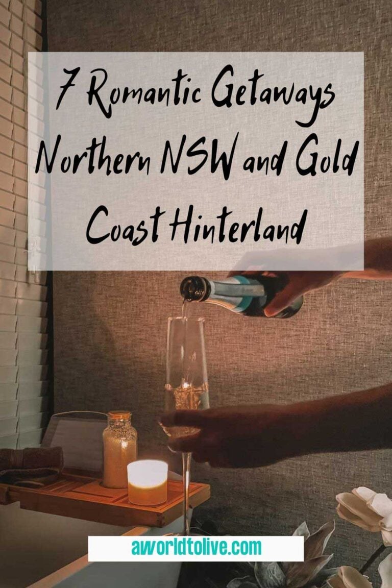 a glass of champagne being poured next to a bathtub being lit by candle light. Article title 7 romantic getaways Northern NSW and Gold Coast hinterland