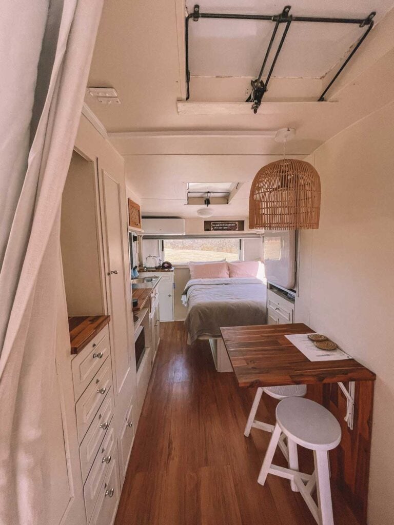 this romantic getaway in Northern NSW is perfect for couples. Image is inside caravan that has been refurbished and listed in airbnb australia