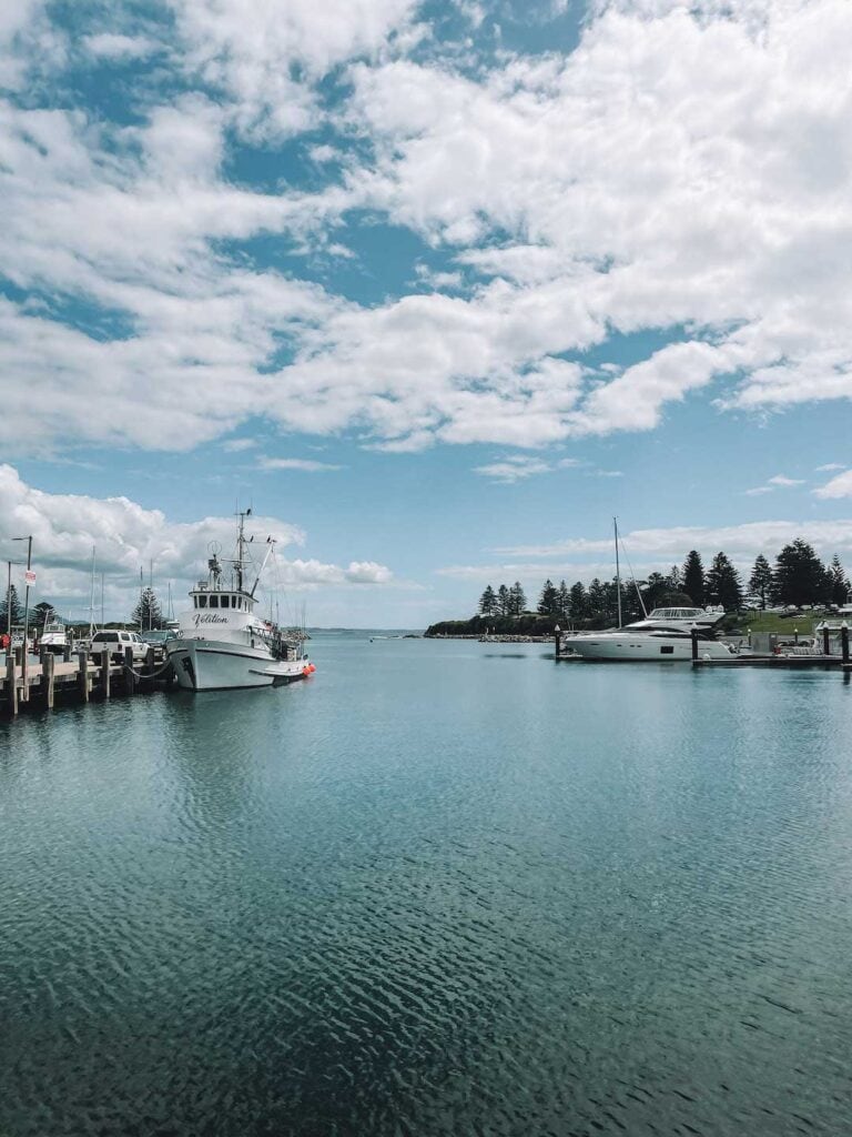 Big fishing boats are docked at Bermagui Fishermans wharf, apart of this guide to the Sapphire Coast