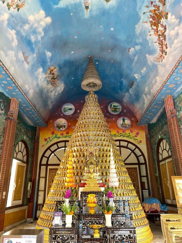 a tall golden Buddhist temple near Bangkok