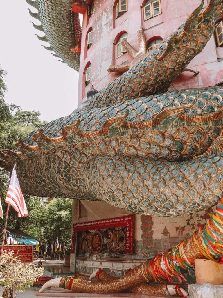 A close up of the dragon's body wrapping around Wat Samphran