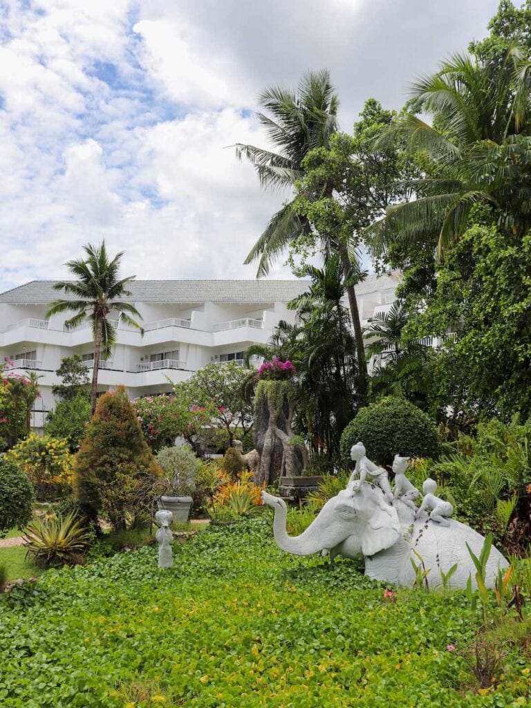 A white elephant statue in the garden at Thavorn Palm Beach Resort, beachfront accommodation in Karon