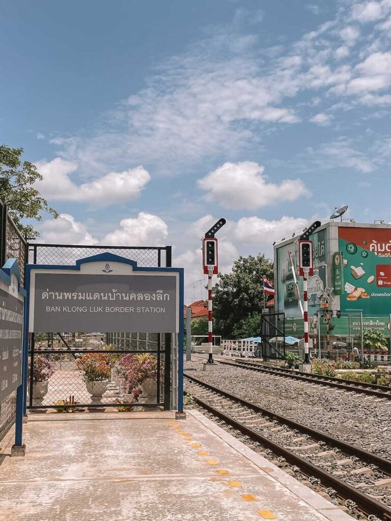 The sign for Ban Klong Luk Border Railway Station, arriving after traveling from Bangkok to Cambodia by train