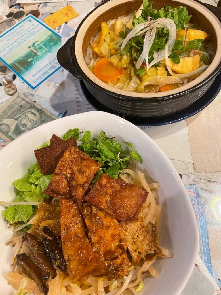 Things to know before traveling to Vietnam, one of which is the best food to eat while in Vietnam. This image is of two local dishes, of them is the famous Cao Lau