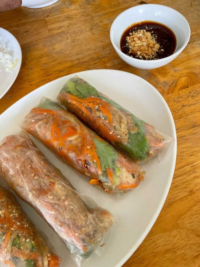 4 freshly made Vietnamese rice paper rolls. This side dish is recommended in guide things to know before traveling to Vietnam