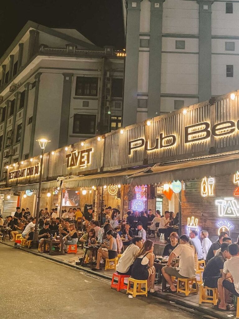A busy pub alone Hues walking street. Patrons sitting out side. Hues nightlife