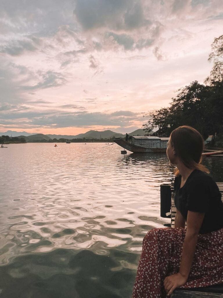 Sitting on the pier by Perfume River, enjoying the sunset behind the mountains. 3 days in hue