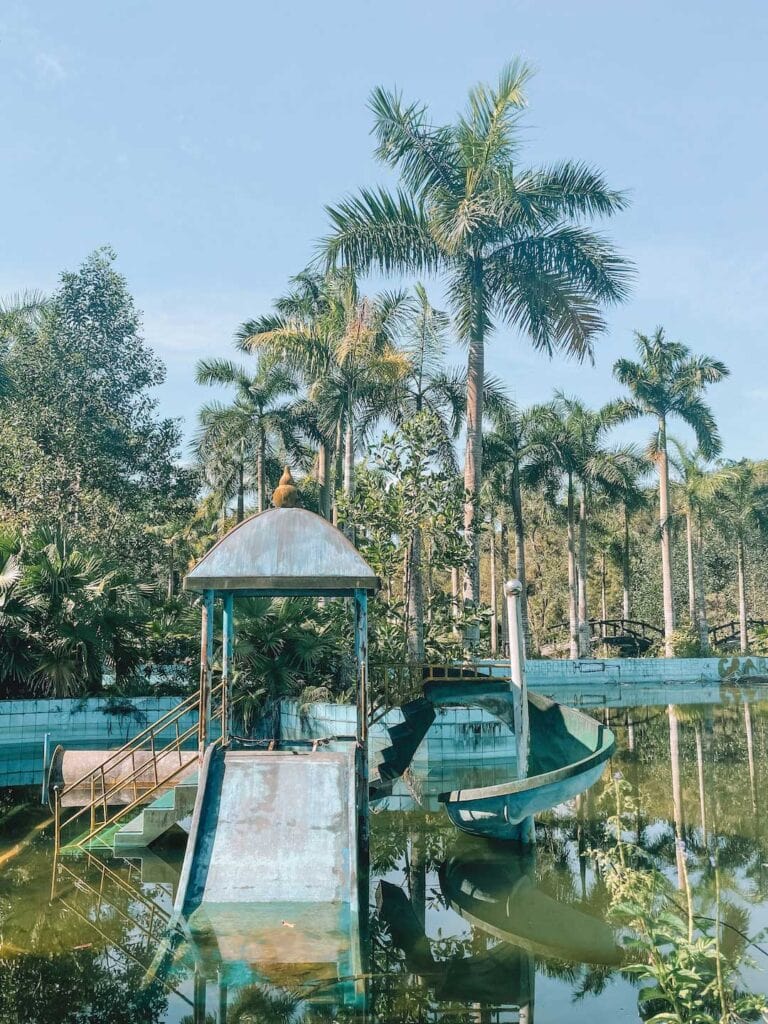 The kids play area at the abandoned water park. Now it is covered in moss and half under water.
