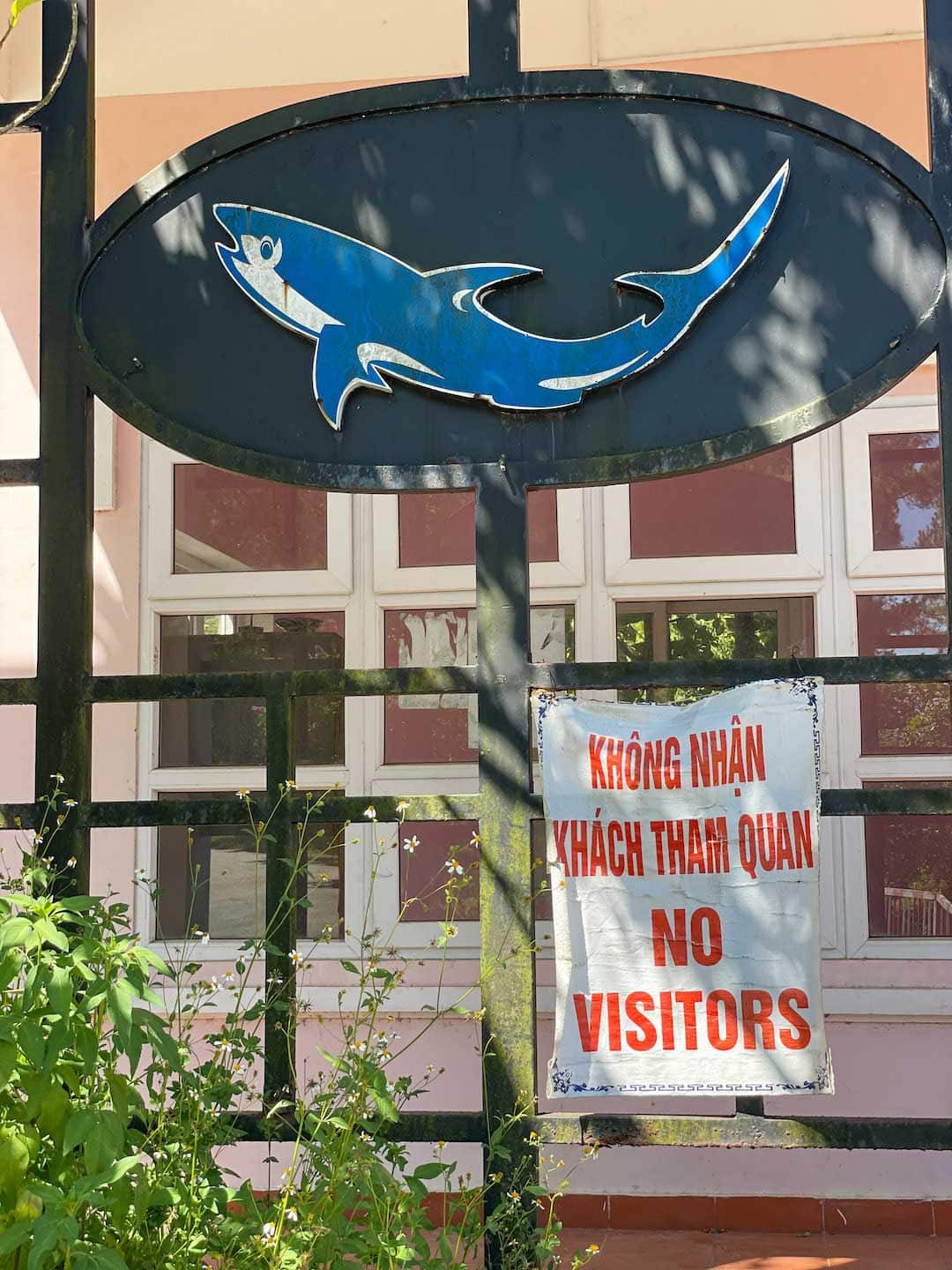 a small banner displaying the words "No Visitors" at the front of the Thuy Tien Lake Abandoned Water Park
