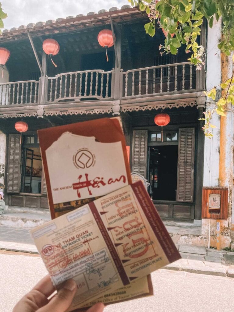 holding up my pass to Hoi An Ancient Town. Hoi An itinerary