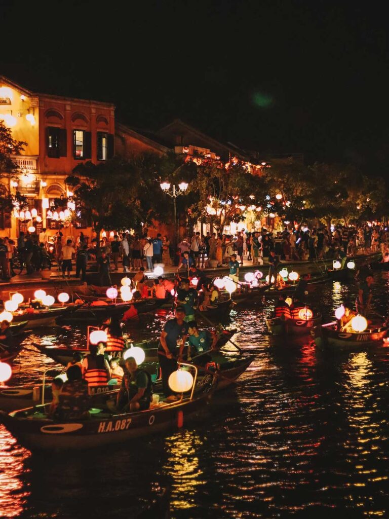 hoi an river packed with wooden boats and colorful lanterns in Hoi An