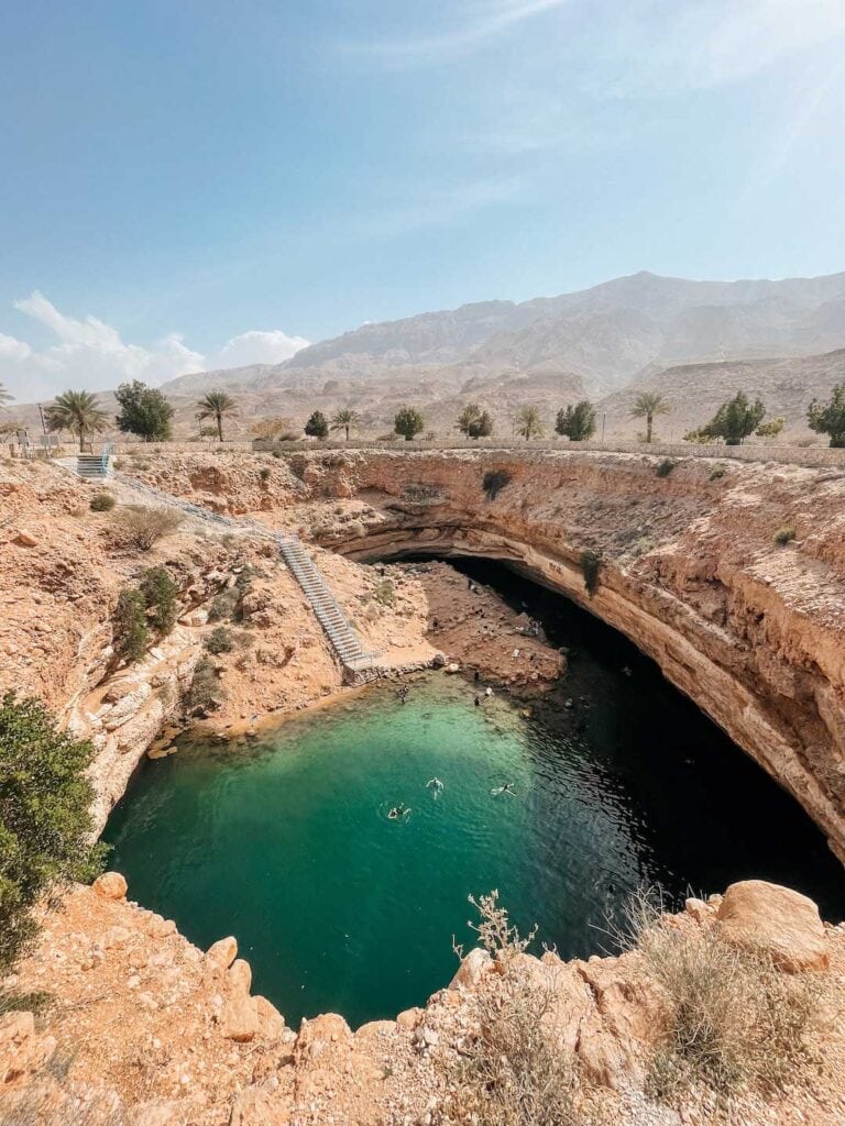 Stop at Bimmah Sinkhole during a road trip in Oman