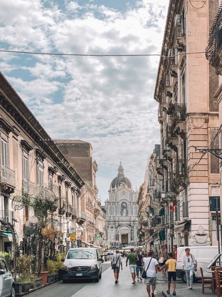 streets of Catania in Sicily, Cathedral in the distance. One of the best day trips from Palermo