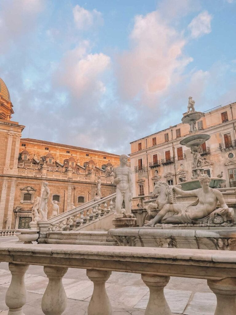Statues surrounding the fountain of shame in Sicily. This guide answers the question, is Palermo worth visiting