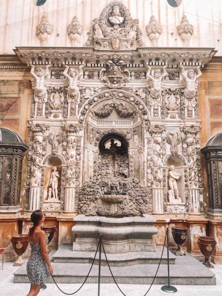 The extremely detailed fountain inside Mirto Palace. This guide answers the question, is Palermo worth visiting?
