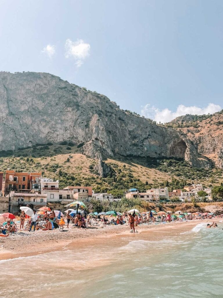 local beach in sicily during European summer. reason why palermo is worth visiting