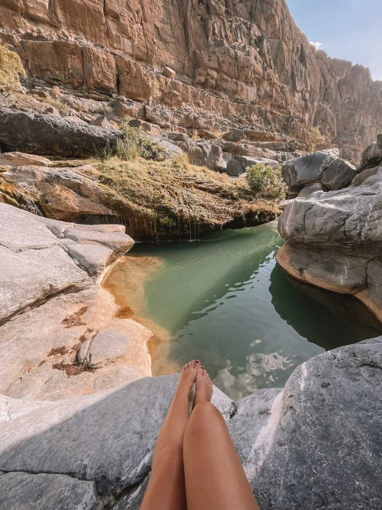 sitting by one of the pools in Wadi Damm. Last stop on 2 week road trip in Oman