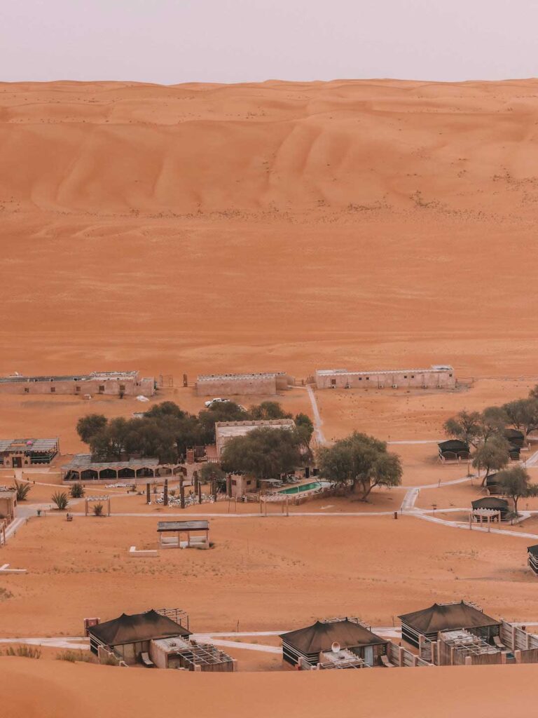 View of the desert camp from the top of the sand dunes in Wahiba sands