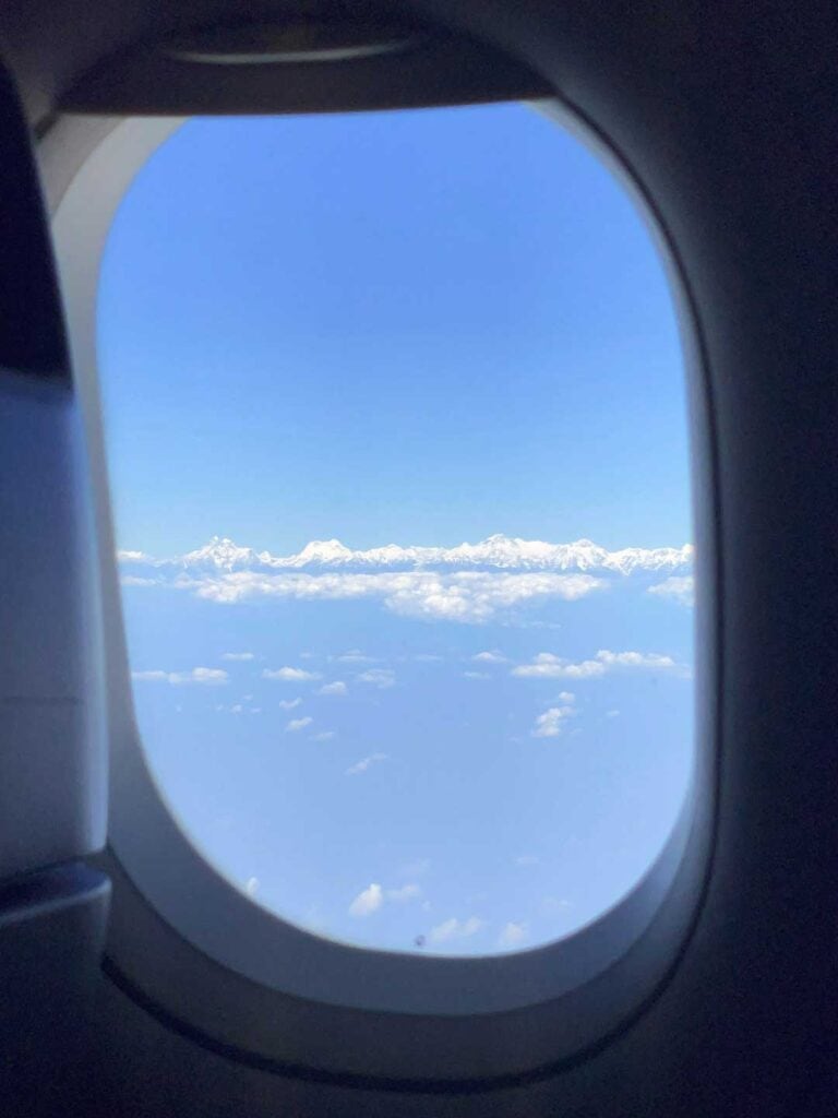 View of the Himalayas mountain range from the plane window