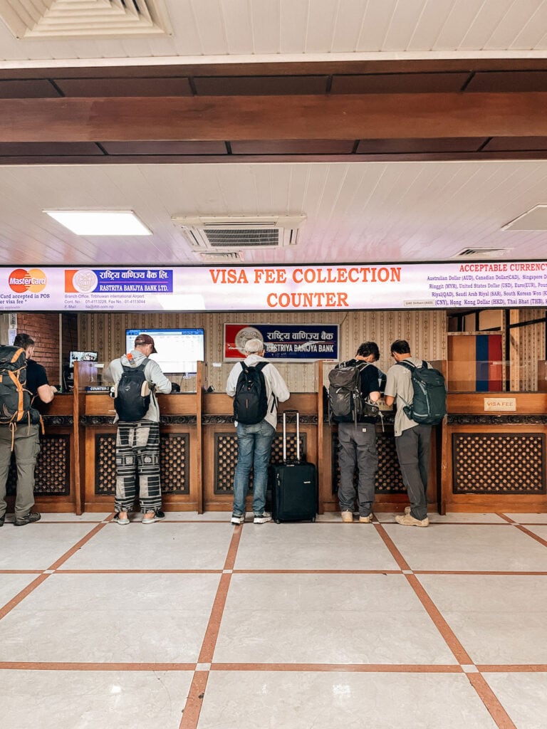 People lining up to pay for their tourist visa for Nepal at Kathmandu airport