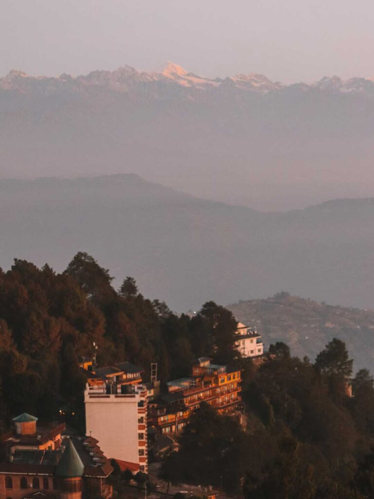 views of the village and snow-covered Himalayas. Weekend getaways from Kathmandu