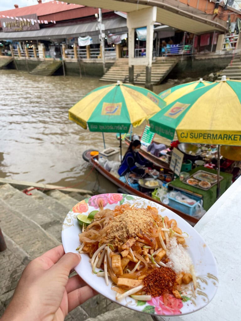 Eating Pad Thai at the floating markets near Bangkok