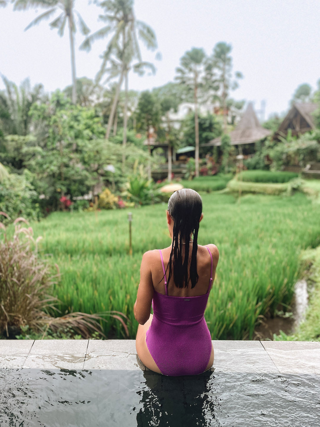 Sitting on the edge of private pool at Menzel hotel in Bali
