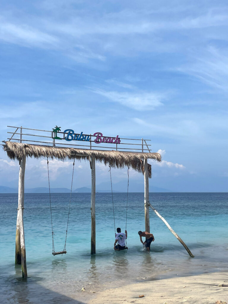 Swing over the ocean at Bubu beach