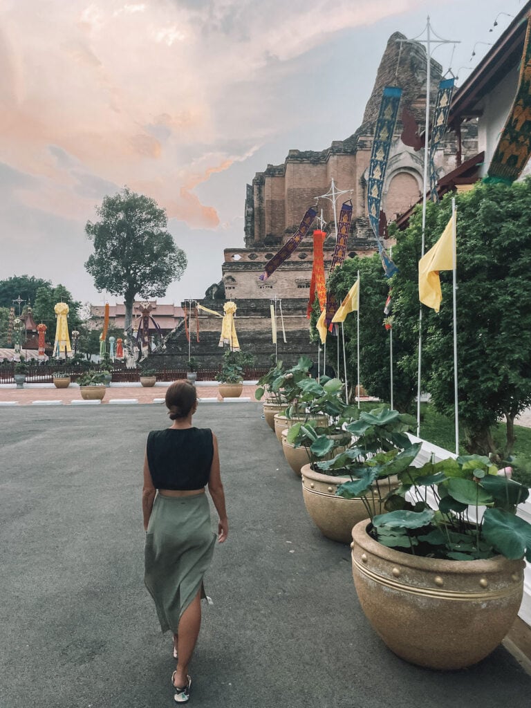 Elyse walking alongside the main temple at Wat Phra Singh in Chiang Mai old town
