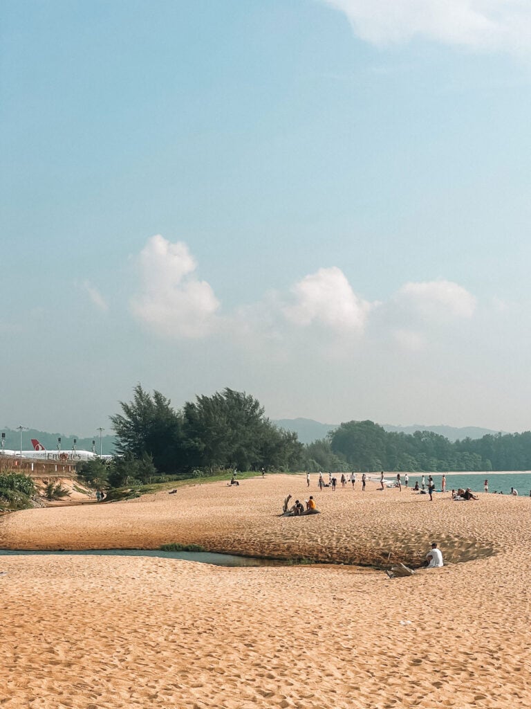 People waiting for planes at Mai Khao beach in Phuket
