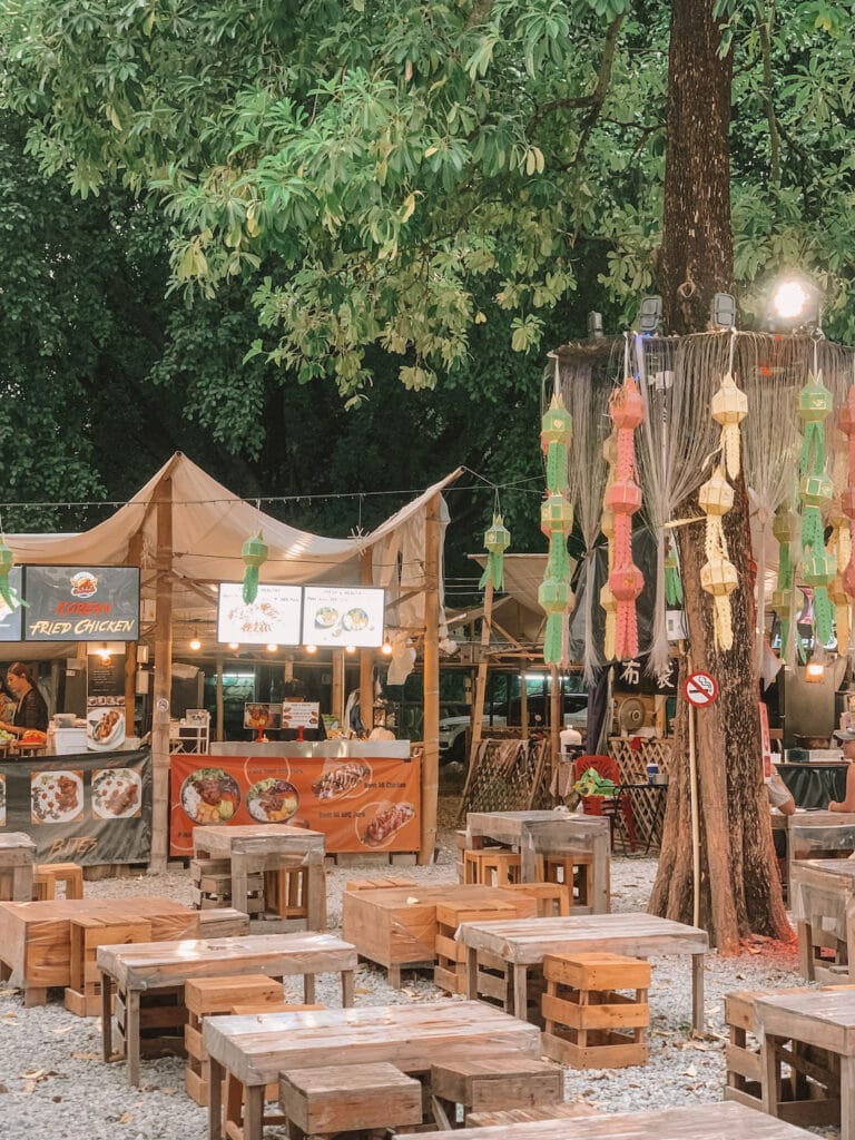 night market in Chiang Mai, outdoor seating and welcoming vibe. Lanna Square Night Market must visit on Chiang Mai itinerary
