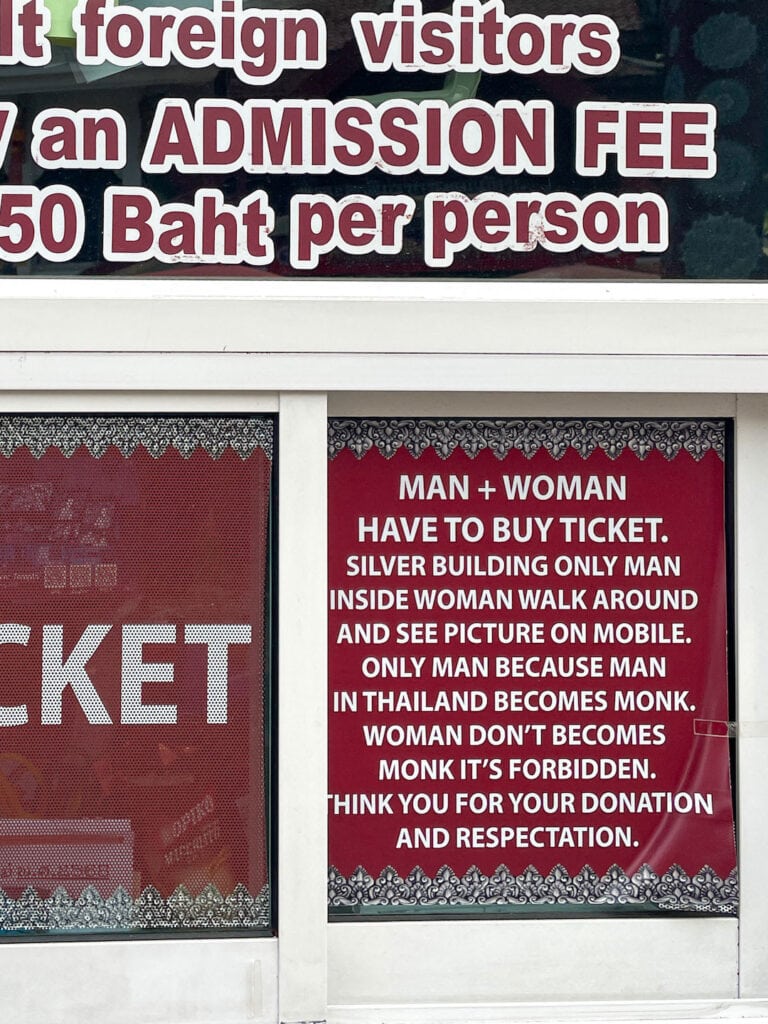 sign at the entrance of the silver temple in Chiang Mai, explaing who can go in and why