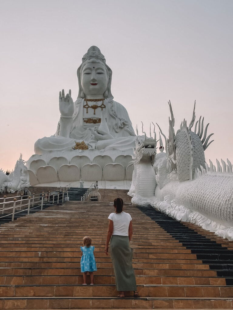 walking up the stair towards the beautiful Guan Yin Statue, along side the large white dragons