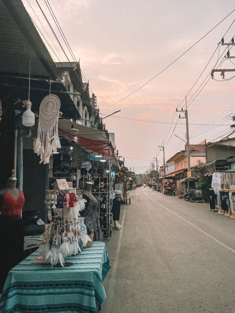 A quiet evening along the Pai Walking Street. Stalls are open along the road selling hand made dream catchers, clothing and other goods